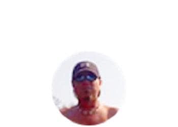 middle aged man with sunglasses and baseball cap